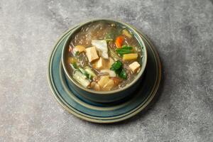 Tofu Veg Soup served in dish isolated on background top view of bangladesh food photo