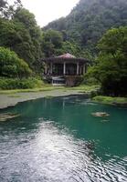 A stone gazebo on the lake. Abkhazian landscape photo