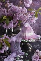 sweet curd orthodox easter on the background of purple sakura, traditional food photo