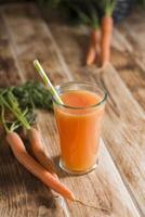 freshly squeezed carrot juice,and raw carrots,vegetarian vegetable vitamin drink photo