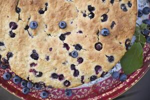 Large freshly baked homemade blueberry pie, summer food, close up photo