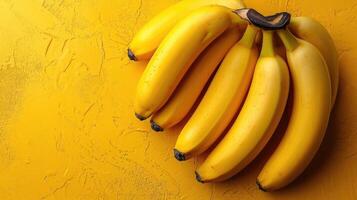 AI generated Top view of fresh yellow bananas isolated on yellow background photo