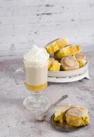 pumpkin cinnabons and latte for dessert, holiday table with pastries, home sweet photo