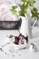 spicy pears cooked in red wine with vanilla ice cream on white dishes,delicious photo
