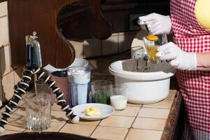 a woman prepares spinach muffins step by step, adds an egg yolk to the dough photo