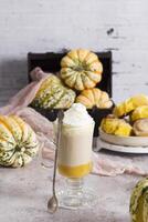 pumpkin cinnabons and latte for dessert, holiday table with pastries, home sweet photo