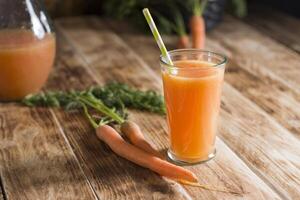 freshly squeezed carrot juice,and raw carrots,vegetarian vegetable vitamin drink photo