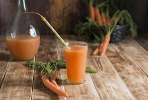 freshly squeezed carrot juice,and raw carrots,vegetarian vegetable vitamin drink photo