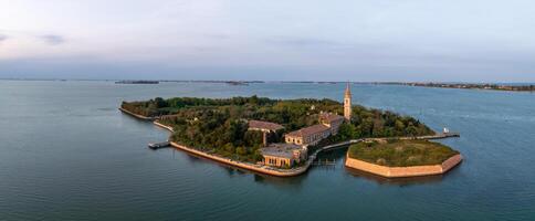 Aerial view of the plagued ghost island of Poveglia in the Venetian lagoon photo