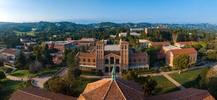 Aerial View of UCLA Campus with Iconic Dome and Towers Amidst Green Hills on Sunny Day photo