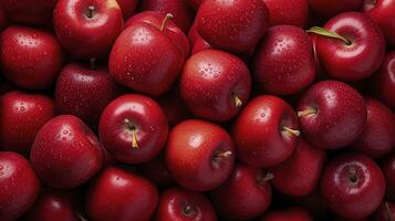 AI generated Red apples background, wet with water droplets, are piled into a large container and photographed from above. photo