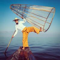 Traditional Burmese fisherman at Inle lake Myanmar photo