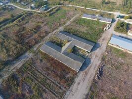 The building of an old farm for cattle. Top view of the farm. Storage of bales of hay on the old farm photo