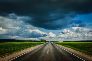 Road and stormy sky photo