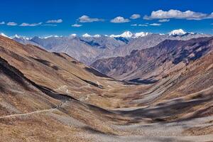 Karakorum Range and road in valley, Ladakh, India photo