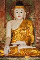 Buddha statue in Shwedagon pagoda photo