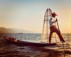 Traditional Burmese fisherman at Inle lake Myanmar photo