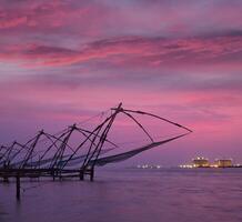 Chinese fishnets on sunset. Kochi, Kerala, India photo