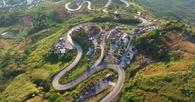 Aerial view of Sunrise Over Mountain Roads and Village in Phu Thap Boek, Thailand video