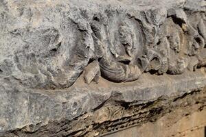 The element of the gate of Hadrian on the ground near the gate. Ruins of ancient construction. photo