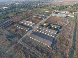 The building of an old farm for cattle. Top view of the farm. Storage of bales of hay on the old farm photo