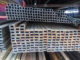 Metalwork profile tubing. Steel bars of rolled metal. photo