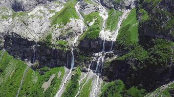 Mountain waterfall landscape. Waterfall mountain view. Top view of green rock waterfall video