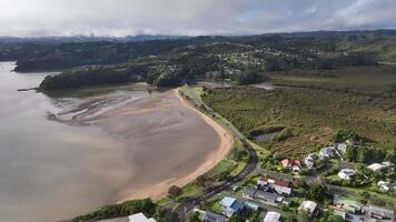 beautiful beach houses cars paihia bay of islands new zealand aerial 4k nature video