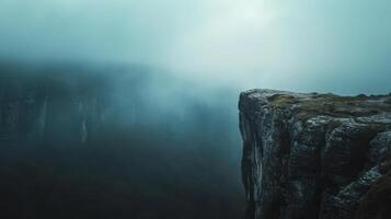 AI generated Rock cliff edge against a fog and clound dark sky with mountain photo