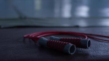 Jump rope lying on the floor, closeup video