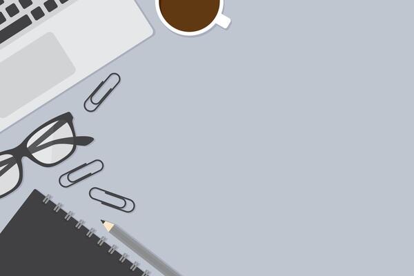 Flat design vector illustration of workspace with office supplies including notebook, laptop computer, coffee cup and stationery. Business concept.