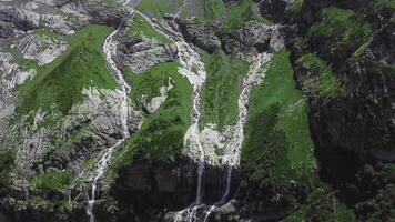 Mountain waterfall landscape. Waterfall mountain view. Top view of green rock waterfall video