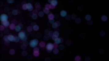 Abstract background with sparkles. Defocused glare moving on black background. Flashing cloudy glare of bright colors video