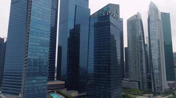 Singapore - August, 2018. Top view of panoramic scene of day of majestic cityscape with modern new buildings. Shot. Modern futuristic buildings architecture. Top view of megapolis skyscrapers with video