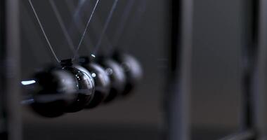 Newton's cradle physics concept for action and reaction or cause and effect. Balls Newton video