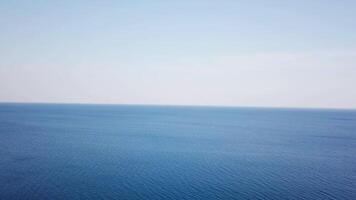 Aerial view Calm Sea and Blue Sky Background. Video. Top view of the sea surface on a Sunny day video