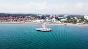 Aerial view of sandy beach in beautiful clear sea water. Video. Top view of the tourist beach by the sea video