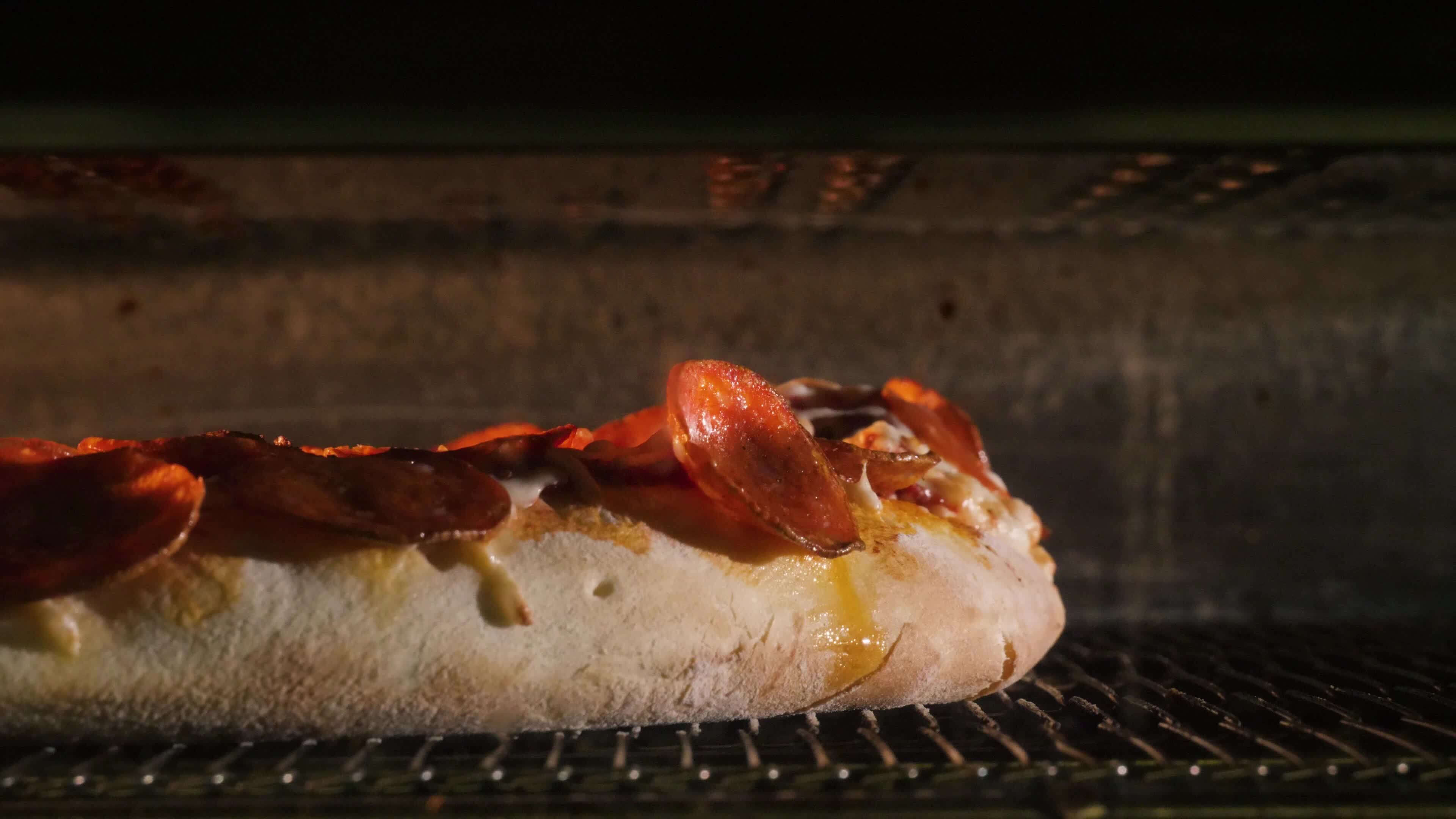 Cooking italian pizza in hot convection oven. Frame. Interior of
