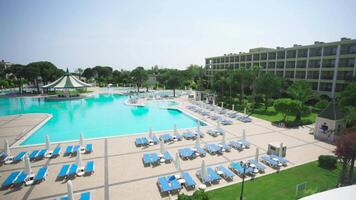 Swimming pool on a sunny day. Video. Beautiful views of tropical gardens, the hotel sundeck and pool video