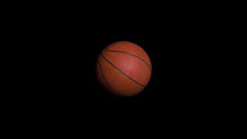 sin costura bucle animación de baloncesto pelota en negro antecedentes. deporte y recreación concepto. animación de un baloncesto pelota video