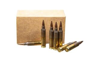 Carbine and rifle cartridges. Ammunition for weapons. Box of cartridges on a white back photo