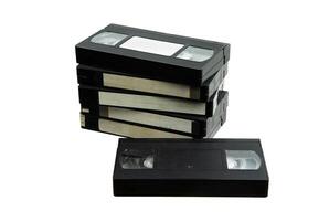Pile of VHS video cassettes. Vintage media. Isolate on a white back. photo