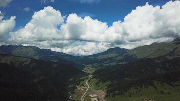 Mountain green range in clouds landscape. Top view of the mountains with sky and clouds video