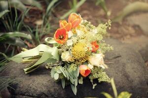 Wedding flowers, bridal bouquet closeup. Decoration made of roses, peonies and decorative plants photo