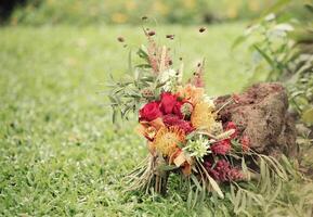 Wedding flowers, bridal bouquet closeup. Decoration made of roses, peonies and decorative plants photo