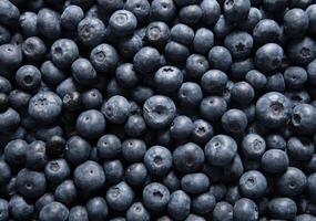 big box with scattered fresh blueberries, fresh raw food, natural healthy food photo