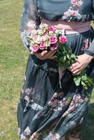 middle-aged woman with a bouquet of pink eustomas a gift for mother's day,spring photo