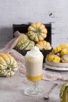 pumpkin cinnabons and latte for dessert, holiday table with pastries, home sweet photo