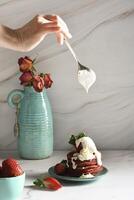 still life with Pink strawberry pancakes on a turquoise plate with sour cream photo