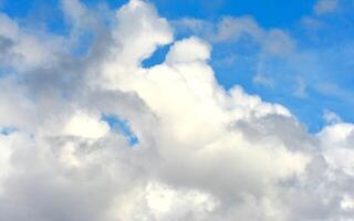 photo of white sky and bright blue clouds